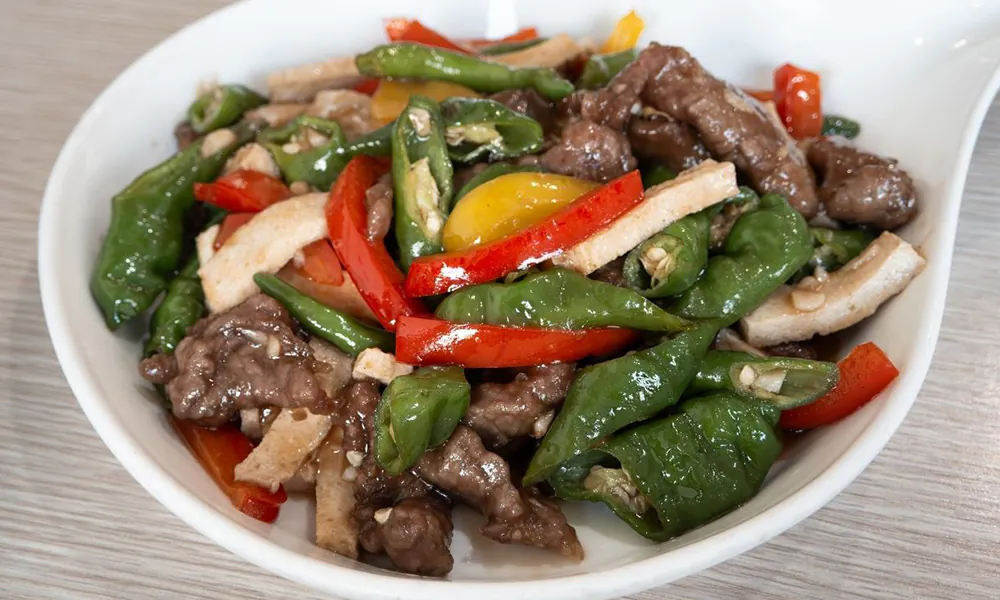 Tender beef stir-fried with tofu and fresh bell peppers in a savory sauce at Golden Dragon Express, a Chinese Restaurant in San Antonio